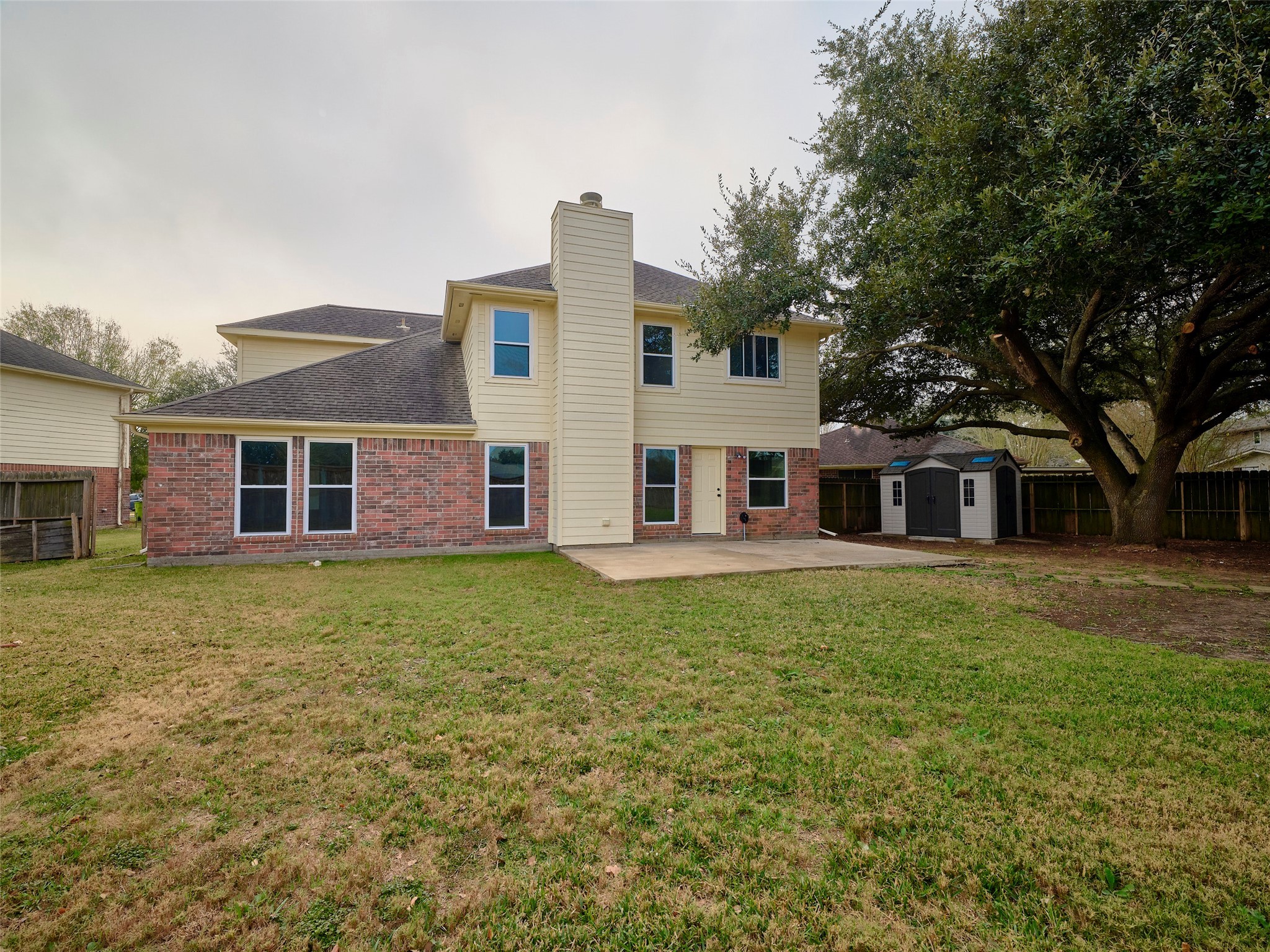 4801 East Columbary Drive Rosenberg, TX 77471 - Photo 50 of 50 a view of a yard in front of a house with large trees