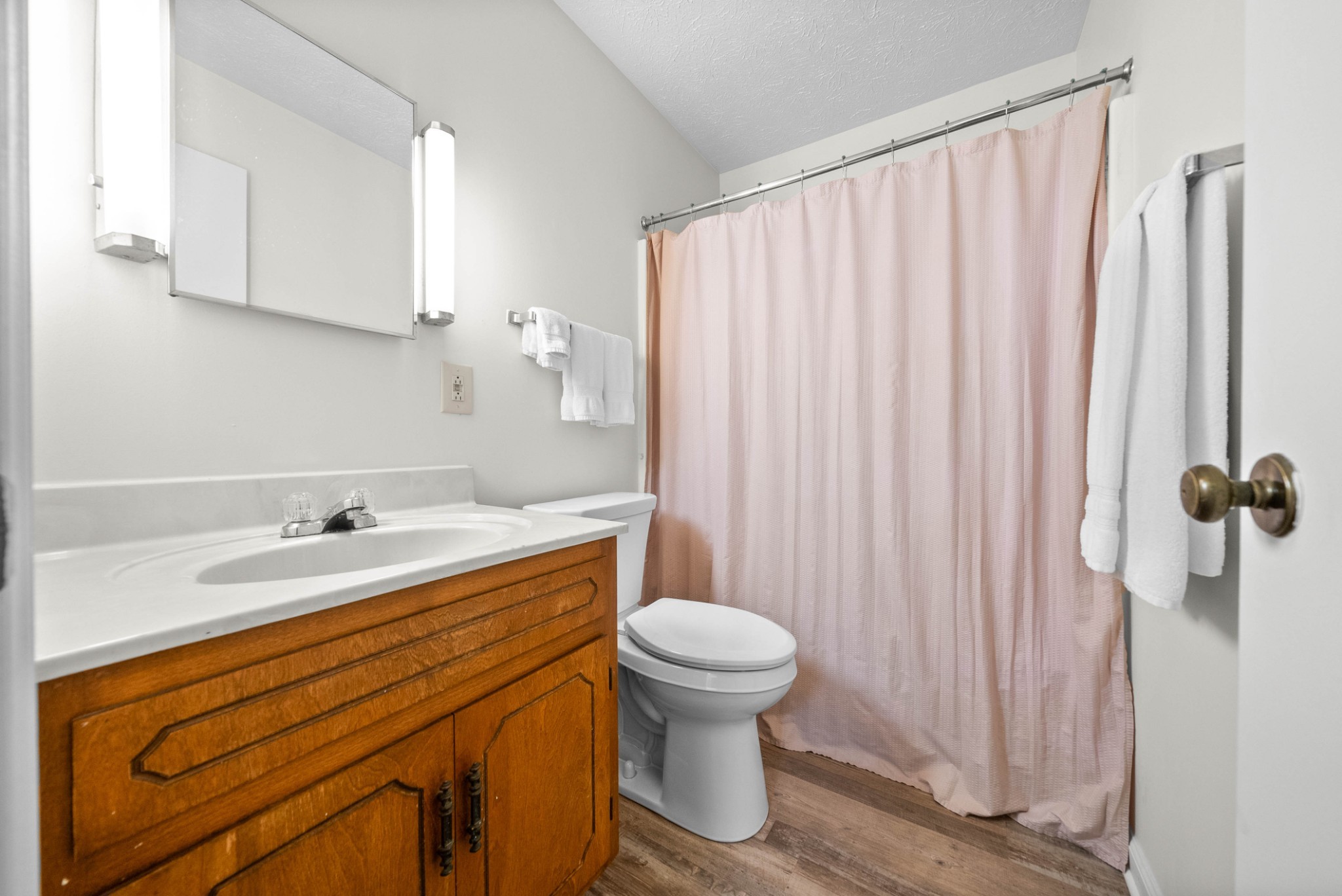 102 Laurel Cove Drive, Unit 30 Hopkinsville, KY 42240 - Photo 11 of 14 a bathroom with a sink a toilet and a mirror