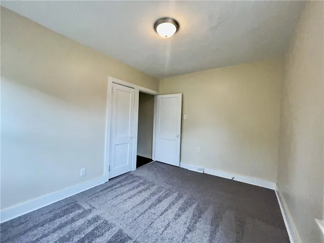 an empty room with a empty space and a window