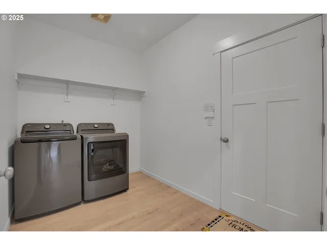 a utility room with washer and dryer