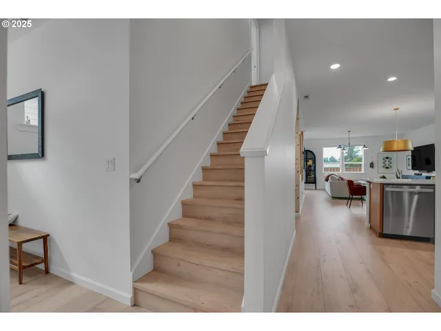 a view of kitchen with furniture and wooden floor