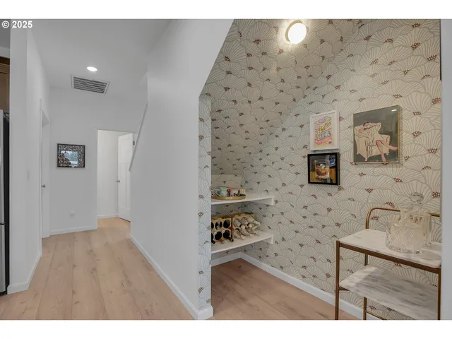 a bathroom with a sink mirror and a shower
