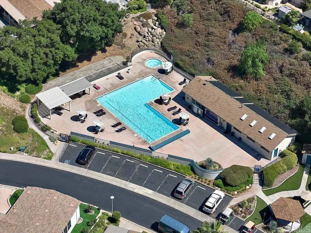 an aerial view of a house a yard and outdoor seating
