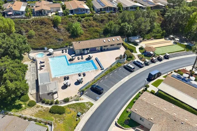 an aerial view of a house with swimming pool