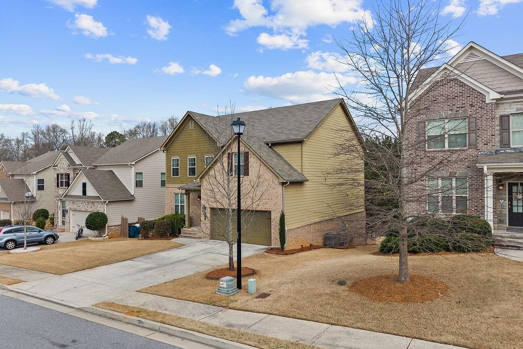 2415 Matlin Way Buford, GA 30519 - Photo 3 of 65 a front view of a house with a yard