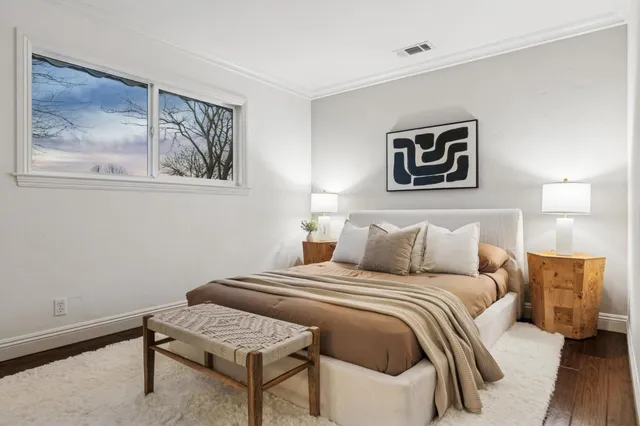 a kitchen with stainless steel appliances kitchen island granite countertop a sink a stove a dining table and chairs