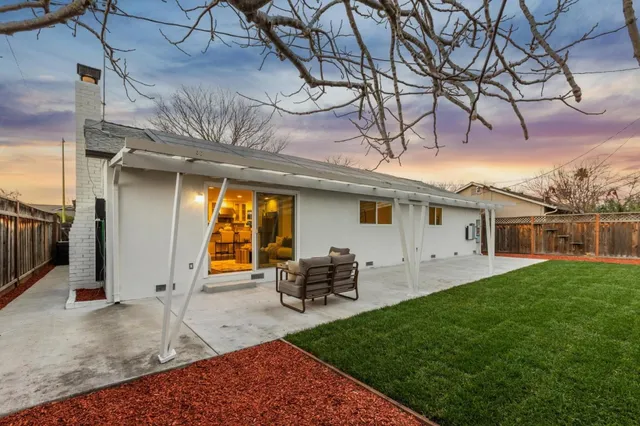 a kitchen with stainless steel appliances a sink stove and cabinets