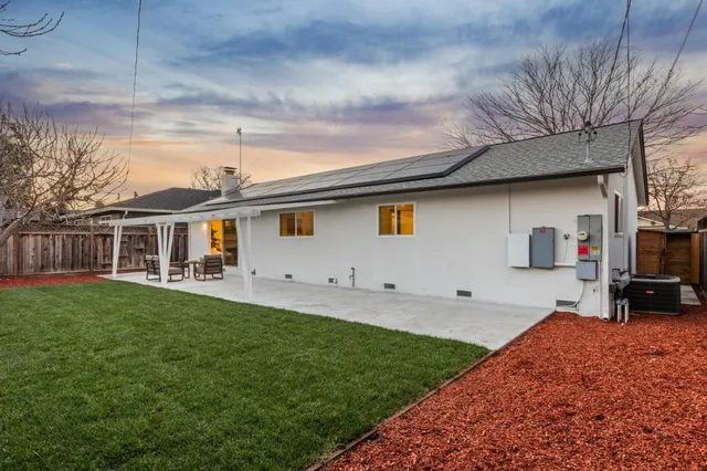 a stove top oven sitting inside of a kitchen