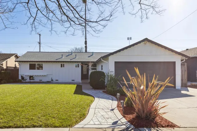 a bedroom with bed and window
