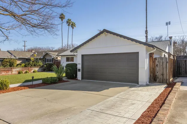 a bedroom with a bed and a mirror