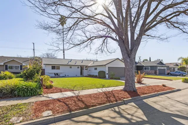 a bedroom with a bed and a mirror