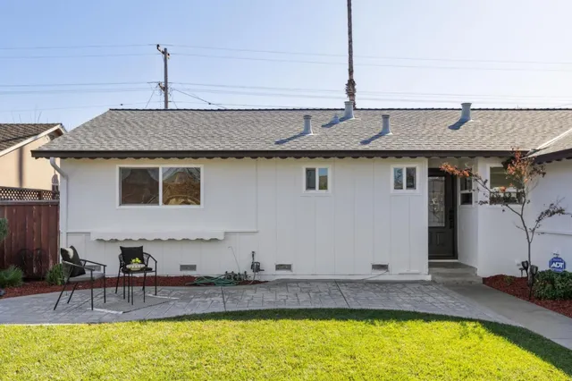 a bedroom with a bed and a mirror