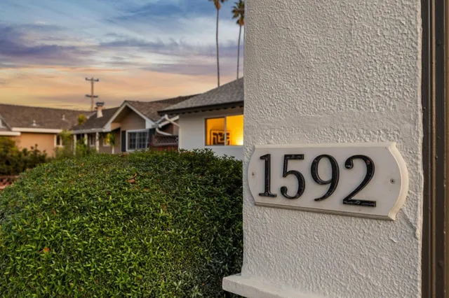 a view of balcony with wooden floor and outdoor seating