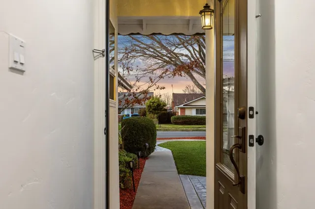 a living room with furniture wooden floor and a fireplace