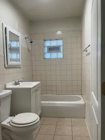a bathroom with a toilet and bathtub