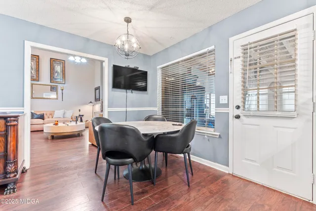 a kitchen with sink a stove and a window