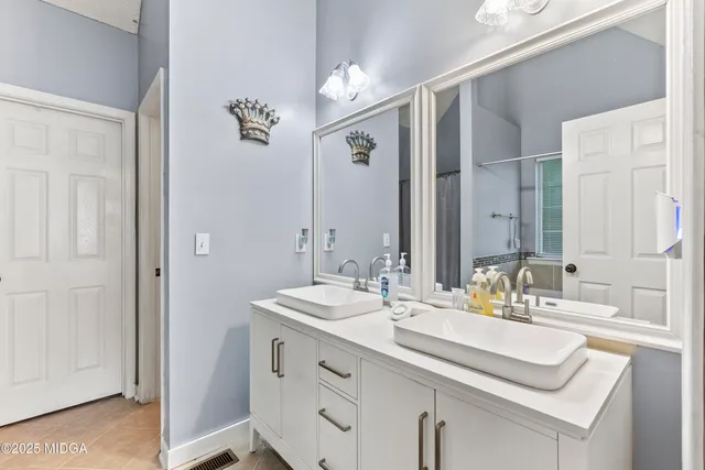 a bedroom with a bed and a couch