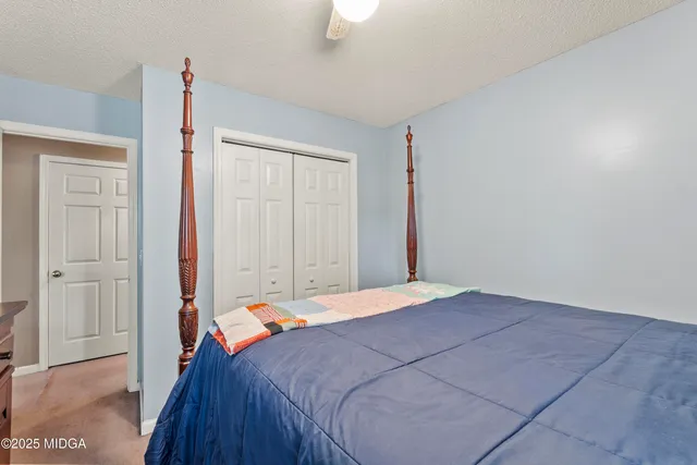 a view of a patio with couches table and chairs and potted plants