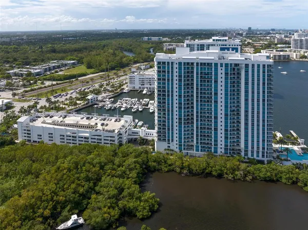 a view of a lake with tall buildings