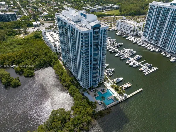 a view of a lake with tall buildings