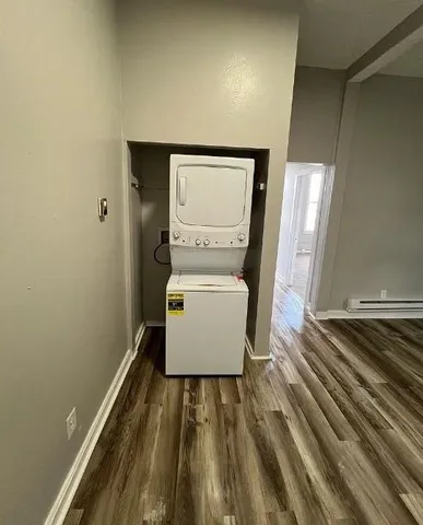 a bathroom with a bathtub sink and mirror
