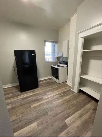 a bathroom with a toilet sink and a mirror