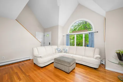 a living room with furniture and a large window