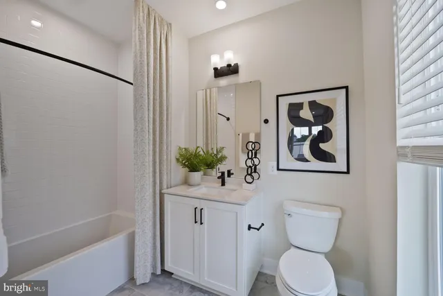 a utility room with sink dryer and washer