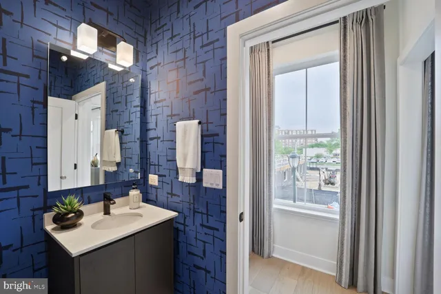 a bathroom with a toilet a sink and mirror