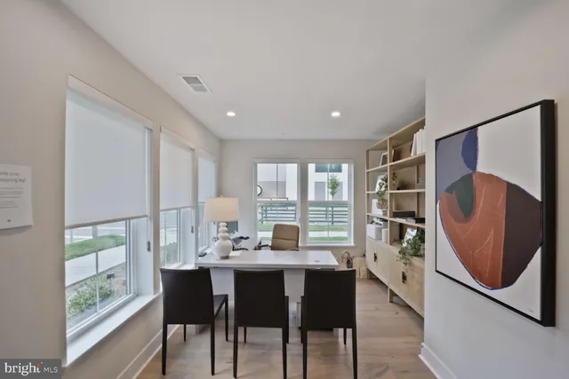a kitchen with counter top space and a view of living room