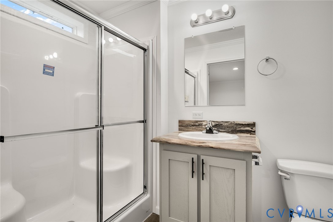 751 South Jones Street Petersburg, VA 23803 - Photo 12 of 13 a bathroom with a sink toilet and shower