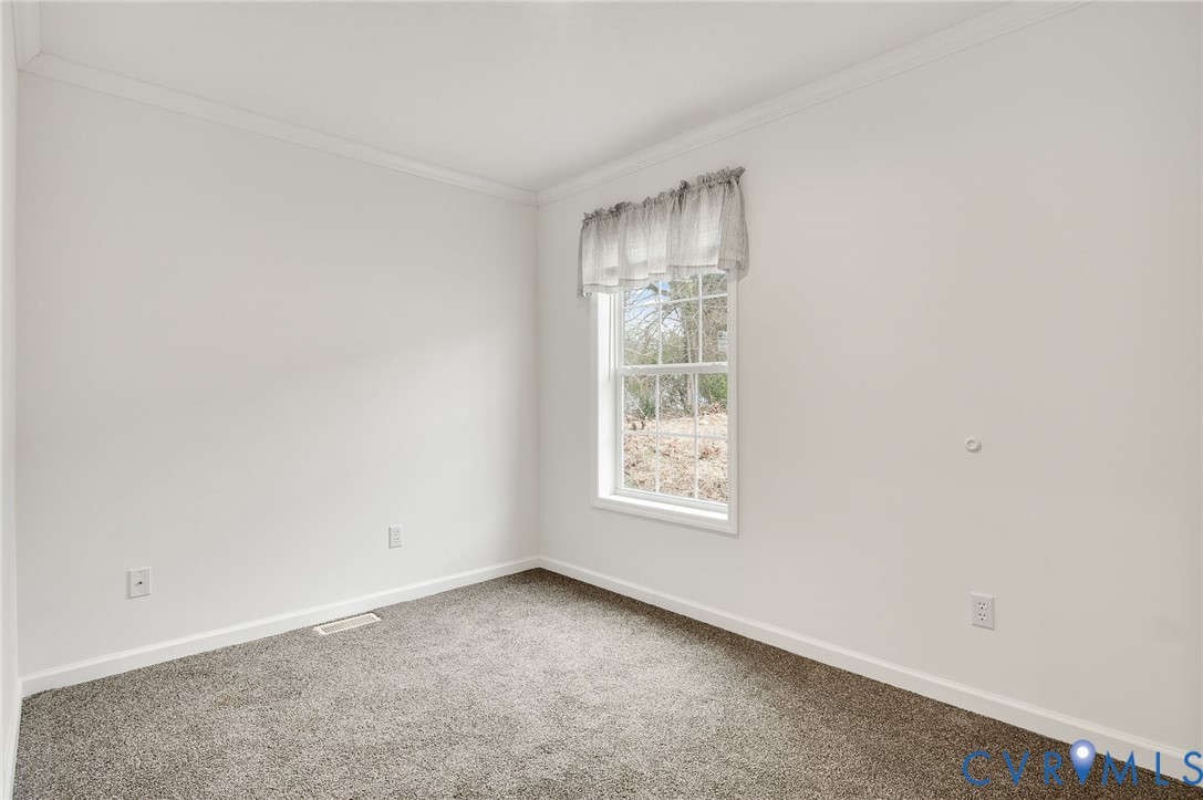 751 South Jones Street Petersburg, VA 23803 - Photo 8 of 13 an empty room with a window