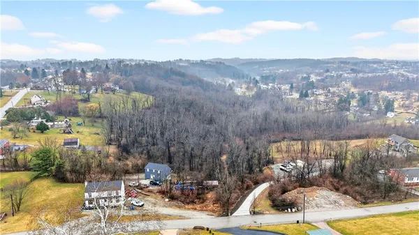 a view of a terrace with a table and chairs