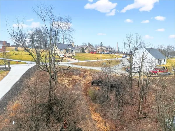 a view of a swimming pool with a yard and mountain view