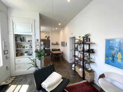 a living room with furniture or wooden floor and a window