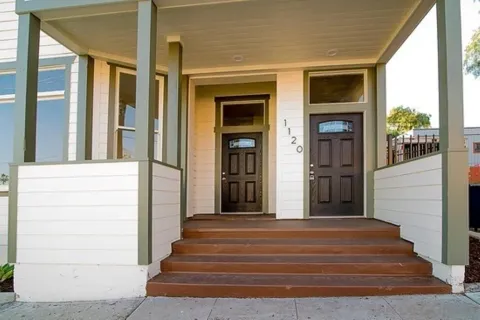 a front view of a house with a porch