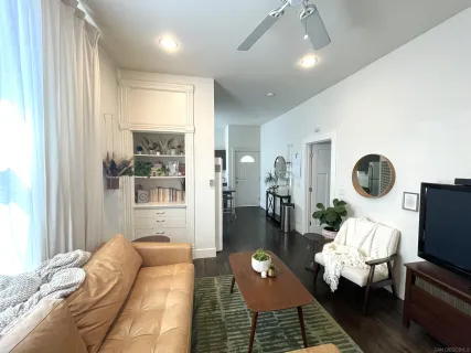 a living room with furniture and a large window