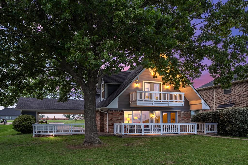 238 Matador Ranch Road Trinidad, TX 75163 - Photo 33 of 37 a front view of a house with a garden