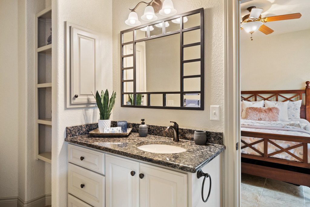 232 Crooked Oak Round Mountain, TX 78663 - Photo 21 of 40 Bathroom with a textured wall, vanity, ceiling fan, and built in shelves