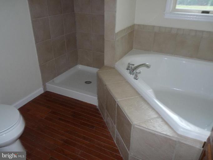 10127 Old Liberty Road Frederick, MD 21701 - Photo 4 of 8 a bathroom with a bathtub