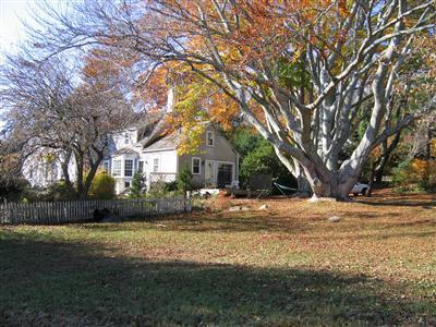 Undisclosed Address Falmouth, MA 02540 - Photo 14 of 14 a view of a house with a yard