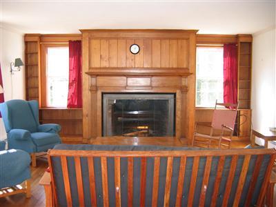 Undisclosed Address Falmouth, MA 02540 - Photo 4 of 14 a living room with furniture and a fireplace