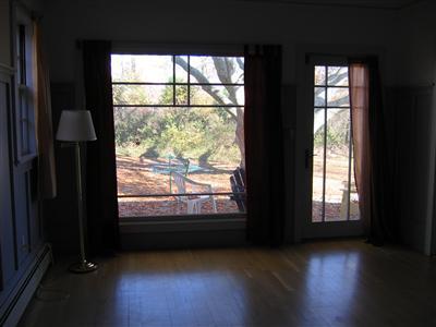 Undisclosed Address Falmouth, MA 02540 - Photo 8 of 14 a view of a room with large windows