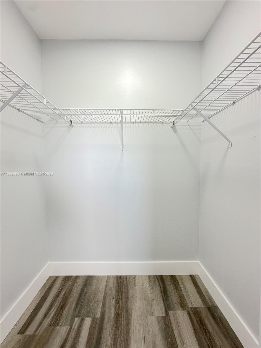 3110 North Pine Island Road, Unit 408 Sunrise, FL 33351 - Photo 14 of 18 a view of a room with racks on the wall