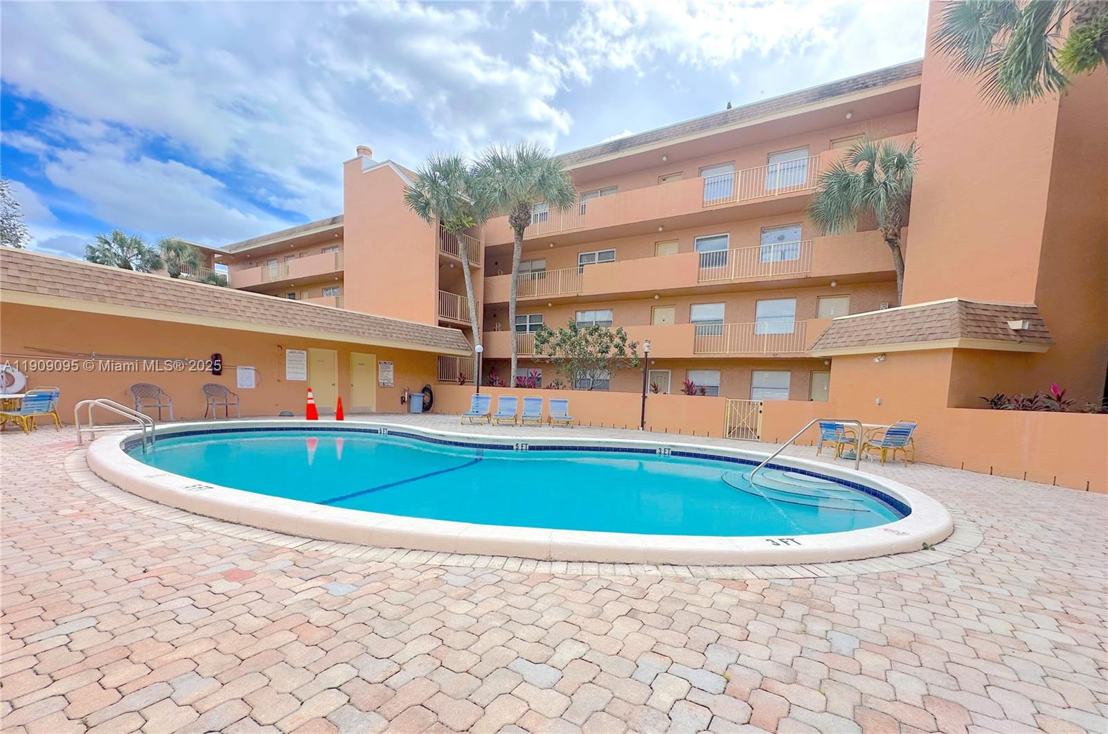 3110 North Pine Island Road, Unit 408 Sunrise, FL 33351 - Photo 18 of 18 a view of swimming pool with outdoor seating