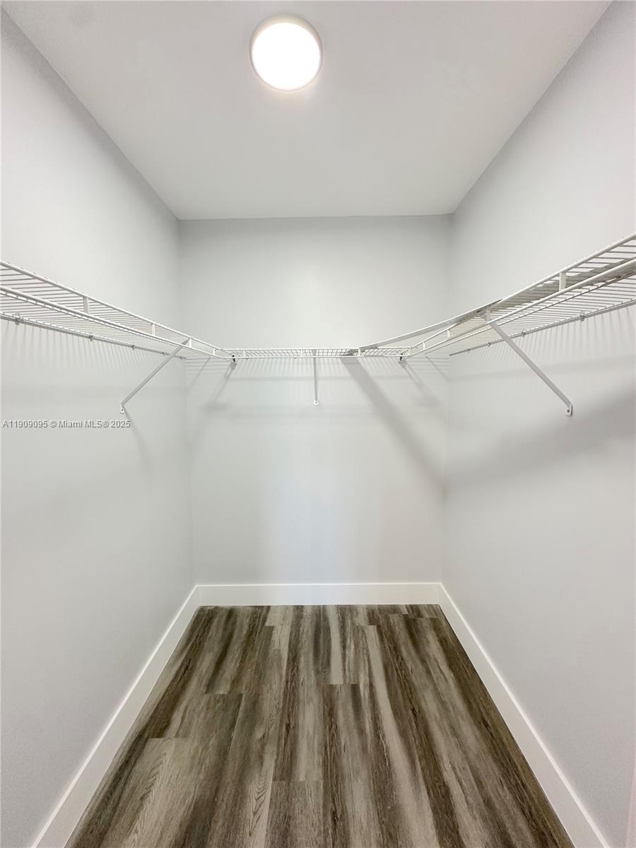 3110 North Pine Island Road, Unit 408 Sunrise, FL 33351 - Photo 10 of 18 a view of a room with racks on the wall