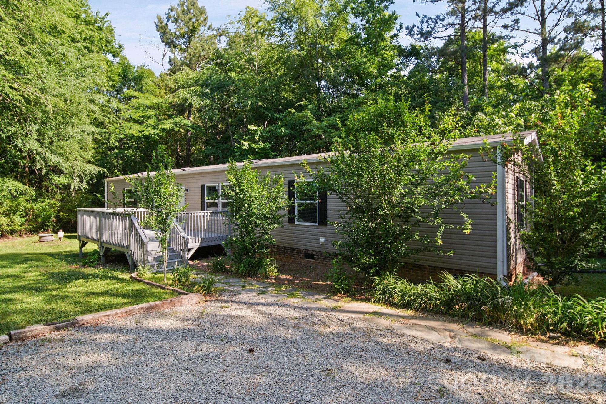 4507 White Store Road Wingate, NC 28174 - Photo 4 of 29 a view of a house with backyard and sitting area