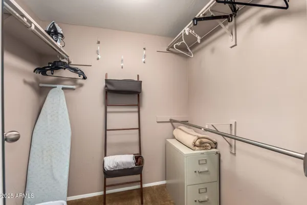 a view of storage and utility room with racks on the wall