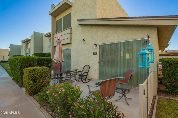 a view of a chair and table in the balcony