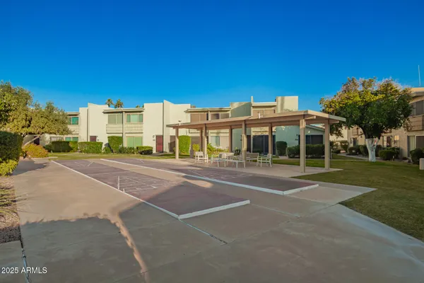 a view of a building with a yard